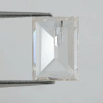 Emerald cut lab grown diamond with step facets, high clarity, transparent stone with visible internal inclusion, ethical IGI certified loose diamond for jewelry setting