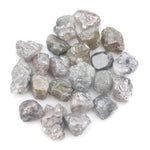 grey brown natural diamond with a rough uncut surface for collectors