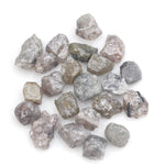 grey brown natural diamond with a rough uncut surface for collectors