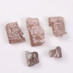 what does a diamond look like before it is cut, what does a diamond look like in the rough, black faceted diamond