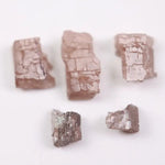 what does a diamond look like before it is cut, what does a diamond look like in the rough, black faceted diamond