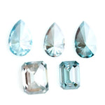 Fancy blue lab grown diamonds in pear and emerald cut shapes, ethical loose lab created diamonds for custom engagement rings and fine jewelry making.