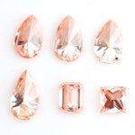 Fancy peach pink lab grown loose diamonds in pear, emerald and princess cut for custom engagement rings and fine jewelry making