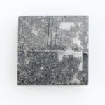 Square cut lab grown diamond with step facets, high clarity, mirror-like reflections, and visible inclusions on a neutral background