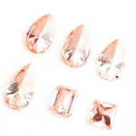 Fancy peach pink lab grown loose diamonds in pear, emerald and princess cut for custom engagement rings and fine jewelry making