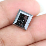 Rectangular step cut salt and pepper lab grown diamond with black galaxy inclusions and scattered white speckles, unique ethical diamond for custom jewelry design