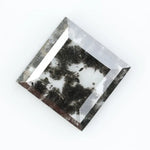 Geometric step cut lab grown salt and pepper diamond with black moss-like inclusions, clear edges and modern faceting, unique ethical loose diamond for alternative engagement ring