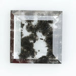 Geometric step cut lab grown salt and pepper diamond with black moss-like inclusions, clear edges and modern faceting, unique ethical loose diamond for alternative engagement ring