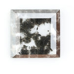 Geometric step cut lab grown salt and pepper diamond with black moss-like inclusions, clear edges and modern faceting, unique ethical loose diamond for alternative engagement ring