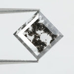 Geometric step cut lab grown salt and pepper diamond with black moss-like inclusions, clear edges and modern faceting, unique ethical loose diamond for alternative engagement ring