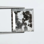 Geometric step cut lab grown salt and pepper diamond with black moss-like inclusions, clear edges and modern faceting, unique ethical loose diamond for alternative engagement ring