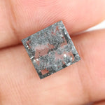 Geometric step cut lab grown salt and pepper diamond with black moss-like inclusions, clear edges and modern faceting, unique ethical loose diamond for alternative engagement ring