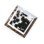 Close-up of a lab-grown diamond featuring unique black inclusions, showcasing exceptional clarity and brilliance, perfect for an elegant jewelry piece.