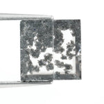 Close-up of a lab-grown diamond featuring unique black inclusions, showcasing exceptional clarity and brilliance, perfect for an elegant jewelry piece.