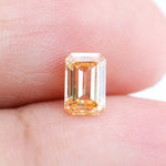 0.67 Ct brown emerald cut lab grown diamond with elegant step cut facets and rich warm tone, loose fancy diamond for custom jewelry making.