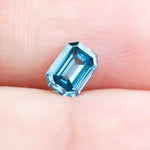 0.37 Ct blue emerald cut lab grown diamond with vibrant fancy blue color and elegant step cut facets, loose diamond for custom fine jewelry.