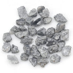 black raw diamond with a natural uncut rough surface for jewelry design projects
