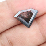 Faceted lab-grown black and white diamond with unique marbled inclusions, perfect for rings, pendants, and ethical jewelry designs.