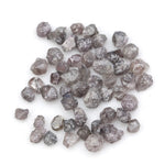 fancy pink raw diamond showing a natural rough surface for gold jewelry design
