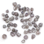 fancy pink raw diamond showing a natural rough surface for gold jewelry design