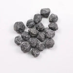 Black Diamond loose stone showcasing deep black color and polished surface for luxury jewelry design