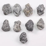 Close-up view of a sparkling gray diamond in a white gold setting.