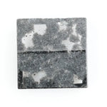 Premium lab-grown diamond with radiant square cut and distinctive black inclusions, offering a unique and sustainable choice for fine jewelry.