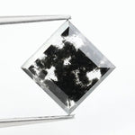 Premium lab-grown diamond with radiant square cut and distinctive black inclusions, offering a unique and sustainable choice for fine jewelry.