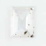 Emerald cut lab grown diamond loose stone with high clarity and subtle natural inclusions, transparent and ethically created for engagement ring or fine jewelry use