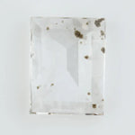 Emerald cut lab grown diamond loose stone with high clarity and subtle natural inclusions, transparent and ethically created for engagement ring or fine jewelry use