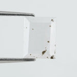 Emerald cut lab grown diamond loose stone with high clarity and subtle natural inclusions, transparent and ethically created for engagement ring or fine jewelry use