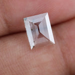 Emerald cut lab grown diamond loose stone with high clarity and subtle natural inclusions, transparent and ethically created for engagement ring or fine jewelry use