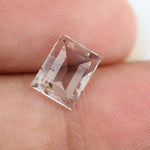 Emerald cut lab grown diamond loose stone with high clarity and subtle natural inclusions, transparent and ethically created for engagement ring or fine jewelry use