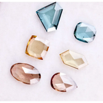 Fancy color lab grown diamonds in blue, yellow and champagne tones featuring cushion, oval, pear and geometric rose cut loose stones for custom jewelry.