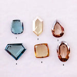 Fancy color lab grown diamonds in blue, yellow and champagne tones featuring cushion, oval, pear and geometric rose cut loose stones for custom jewelry.