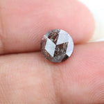 Close-up of a premium round cut brown lab-grown diamond with sparkling facets, showcasing eco-friendly, conflict-free quality and unique natural-like inclusions.