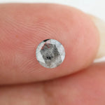 Round brilliant cut lab-grown salt and pepper diamond with unique gray and black inclusions, perfect for custom rings and fine jewelry.