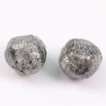 Conflict-free rough gray diamonds in organic matching pair for minimalist ring design