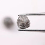 Conflict-free rough gray diamonds in organic matching pair for minimalist ring design