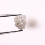 Rare uncut diamonds with organic texture and industrial elegance.