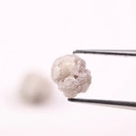 Rare uncut diamonds with organic texture and industrial elegance.