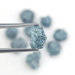 blue natural rough diamond pieces displayed for engagement ring and jewelry projects