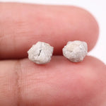 Rare uncut diamonds with organic texture and industrial elegance.