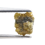 Uncut yellow diamond in natural rough form, weighing 0.92 carats, suitable for a gold promise ring design