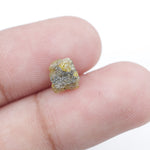 Uncut yellow diamond in natural rough form, weighing 0.92 carats, suitable for a gold promise ring design