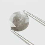 Round-cut salt and pepper lab-grown diamond with unique natural inclusions, ethically created for custom engagement rings and fine jewelry