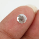 Round-cut salt and pepper lab-grown diamond with unique natural inclusions, ethically created for custom engagement rings and fine jewelry