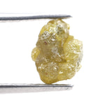 1.23-carat yellow raw diamond in its natural rough form, suitable for a gold band ring setting.