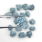 blue natural raw diamond pieces arranged as a loose uncut rough diamond lot