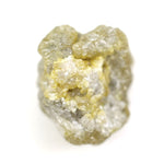 natural yellow uncut diamond with a rugged surface, suitable for designing a distinctive custom ring.